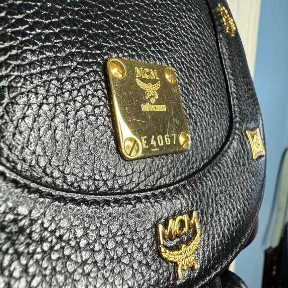 MCM Like New Studded Logo Black Pebbled Leather Backpack Tassel Drawstring - Picture 3 of 15